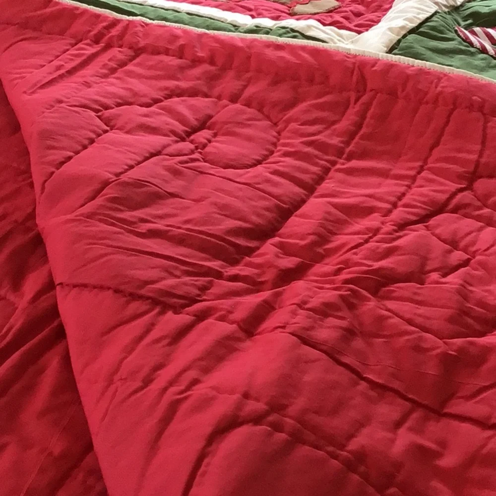 Handmade Christmas-themed applique quilt